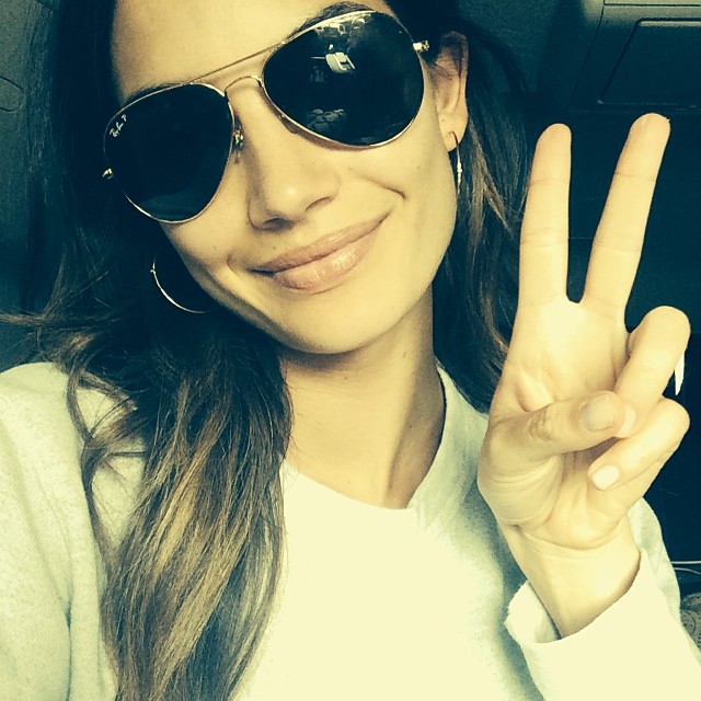 Lily Aldridge flashes the peace sign