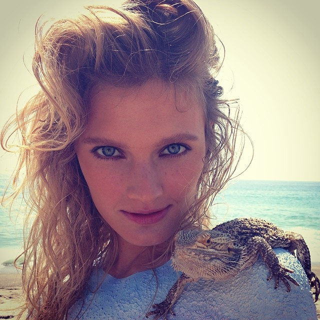 Constance Jablonski with an iguana 