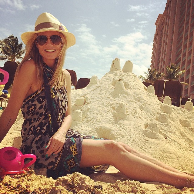 Heidi Klum with sand castles on the beach