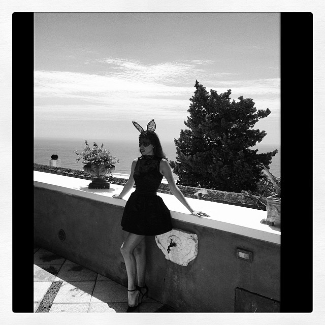 BLACK & WHITE: Irina poses in dress and bunny ears. Image: Instagram alikavoussi