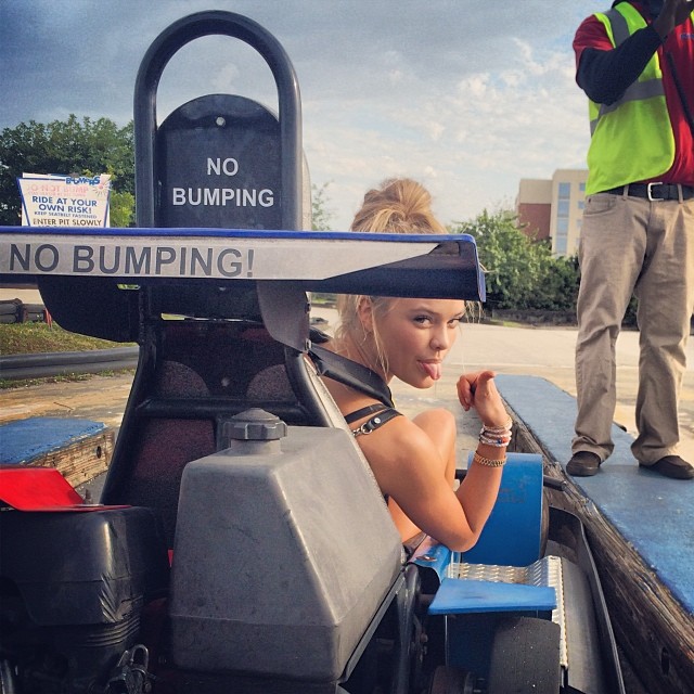 Nina Agdal has fun with bumper cars