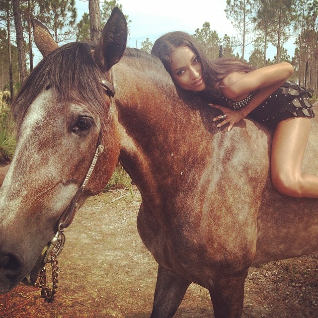 Anais Mali poses on a horse