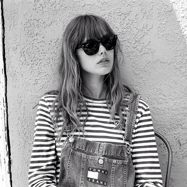 Frida Gustavsson in denim overalls look