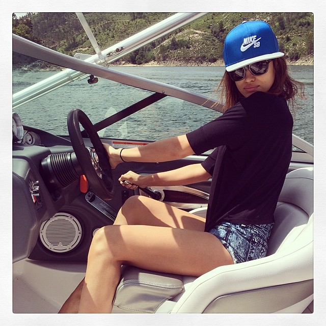 Irina Shayk steers a boat