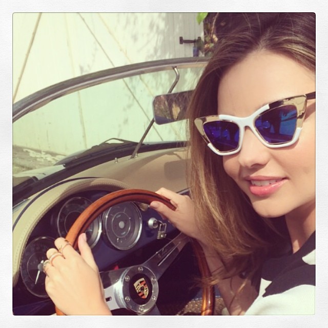 Miranda Kerr drives a car in sunglasses