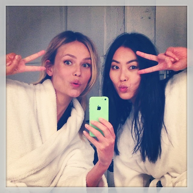 Natasha Poly and Liu Wen take a selfie while on set