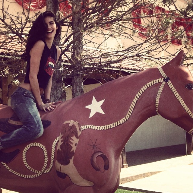 Sara Sampaio poses on a horse