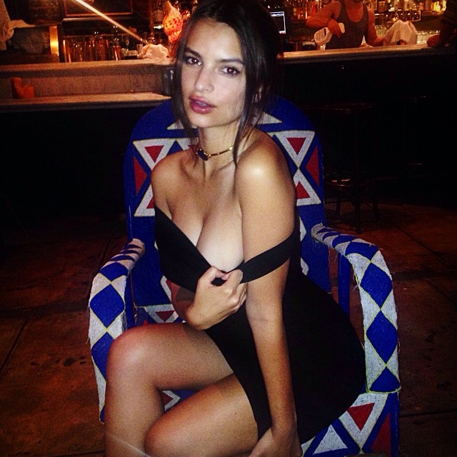 Emily Ratajkowski reveals some cleavage