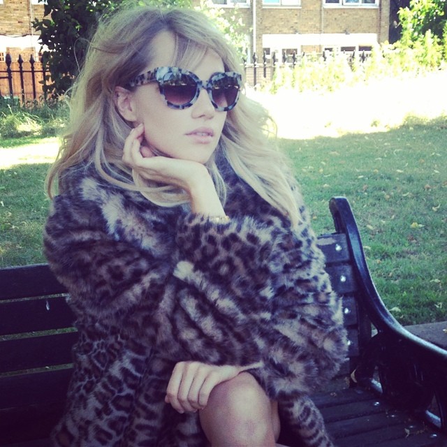Suki Waterhouse in fur coat and sunglasses