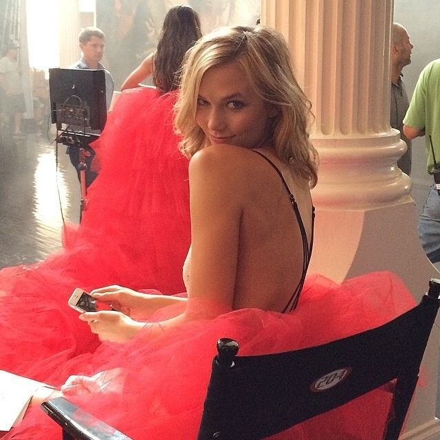 Karlie Kloss poses on set for VS