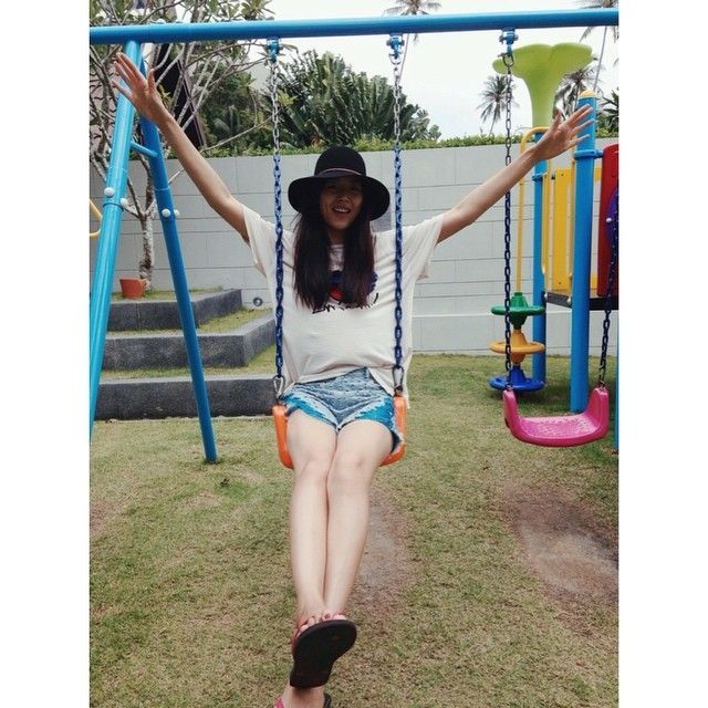 Liu Wen poses on swing