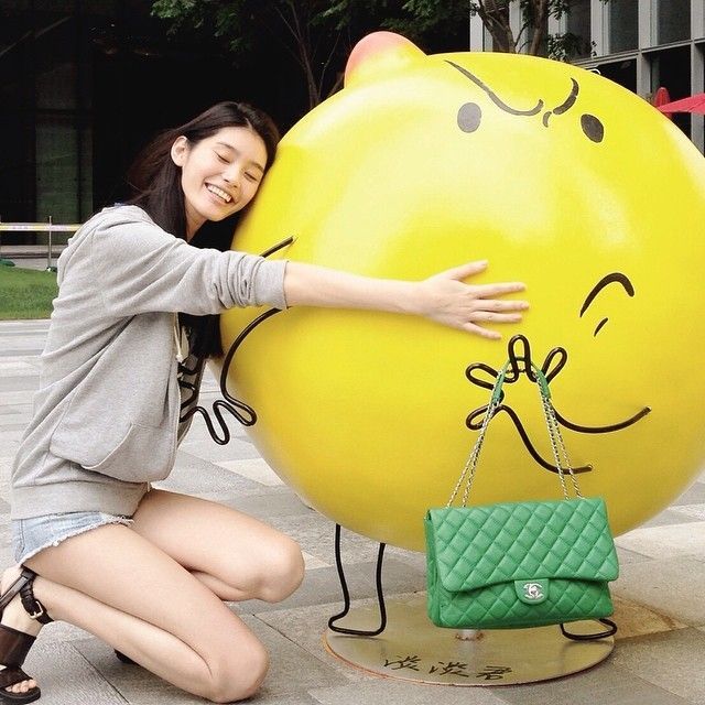 Ming Xi poses with giant lemon