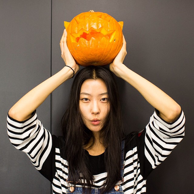 Ji Hye Park with a carved pumpkin