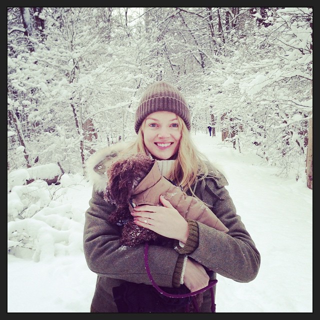 Lindsay Ellingson in the snow with her dog