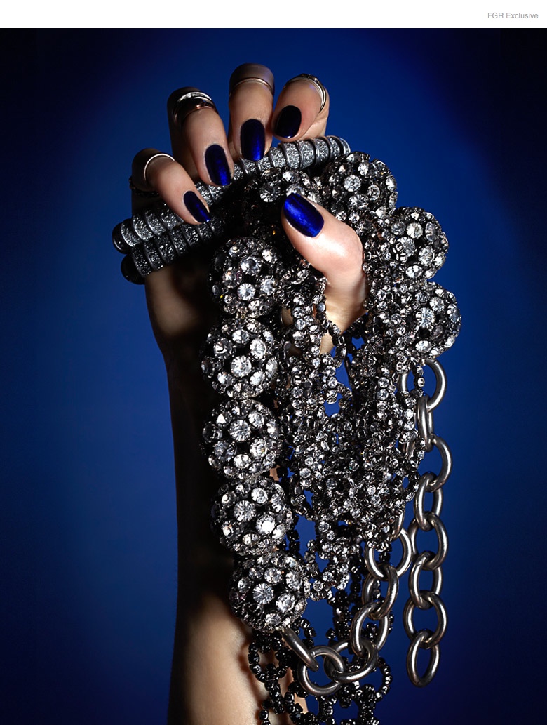 (From Outside In) Stylist’s own Midi Rings, KMO 2 Top Bracelets, Janis Savitt Crystal Disco Ball Necklace, Vera Wang Crystal Chain-Link Necklace, Nail Color Bouncer by Essie, Matte Topcoat by Caption