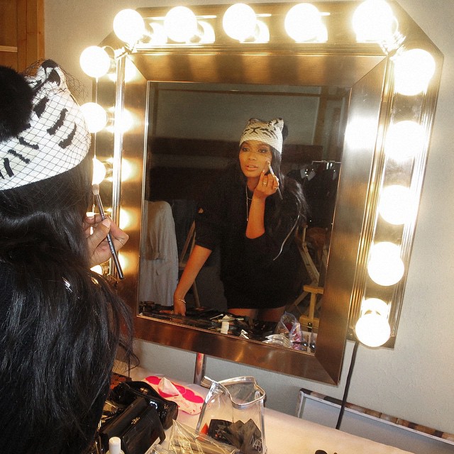 Chanel Iman puts the final touches on her beauty look