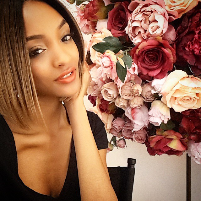 Jourdan Dunn poses with a lovely arrangement of flowers