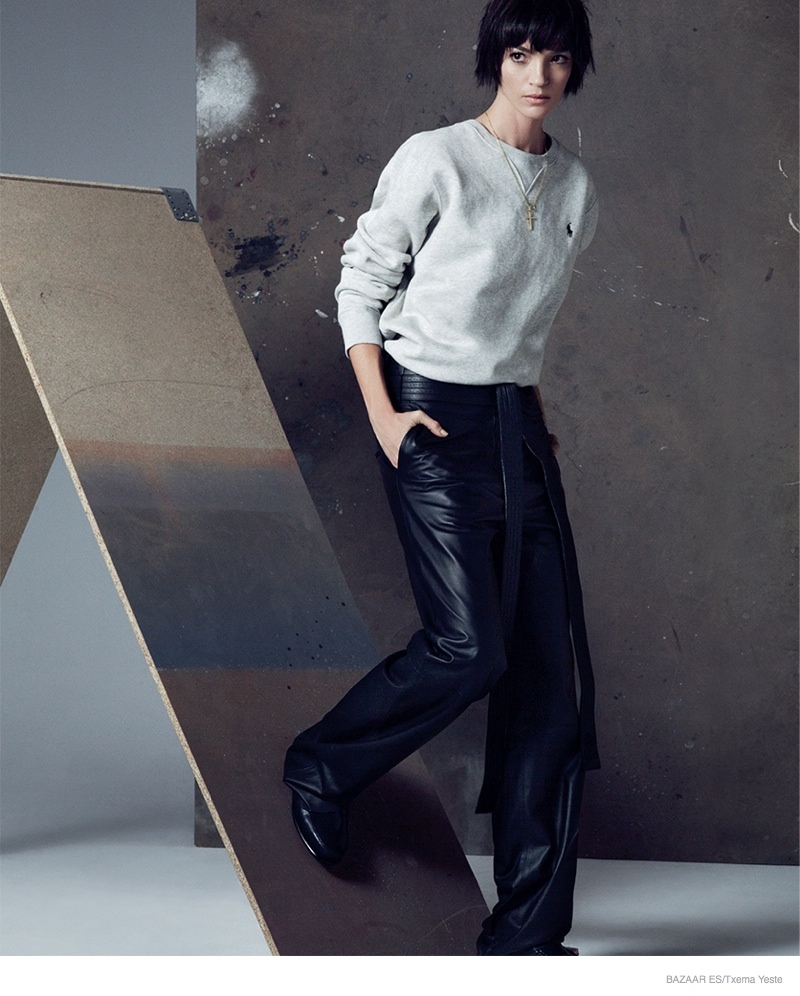 Mariacarla's androgynous side shines through with a short hairstyle and sweater + pants look.