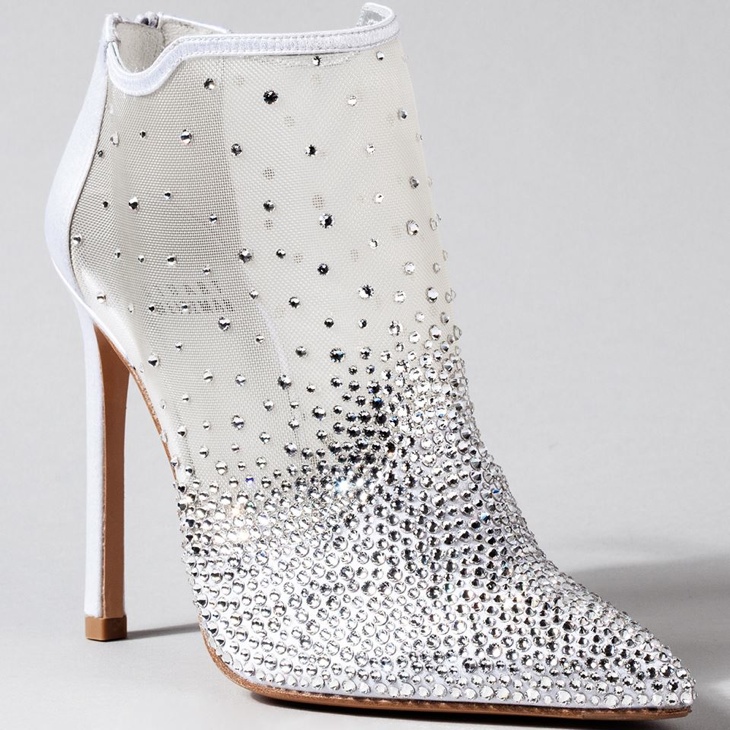 Stuart Weitzman went for a more modern shoe silhouette with a diamond and see-through bootie. 