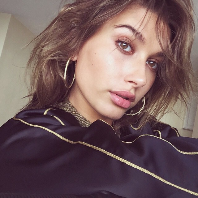 MAY 2015: Hailey takes her brunette lighter with blonde highlights. Photo via Instagram. 