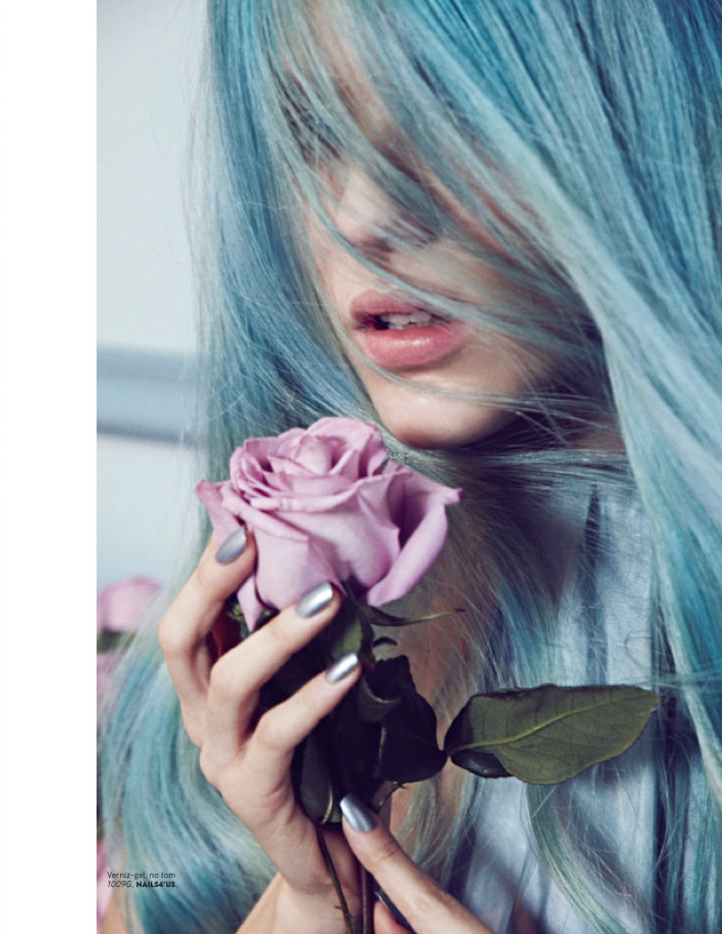 Klaudia takes on an icy blue hairstyle for this image