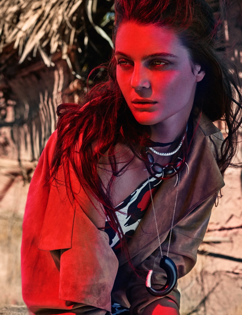 The Spanish model gets cloaked in a brown jacket and printed dress