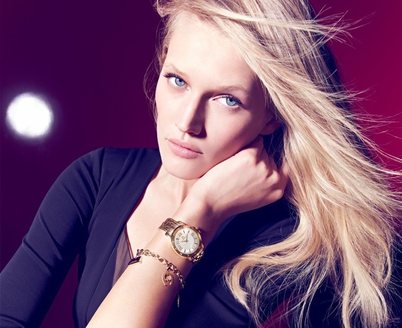 Toni wears a gold watch