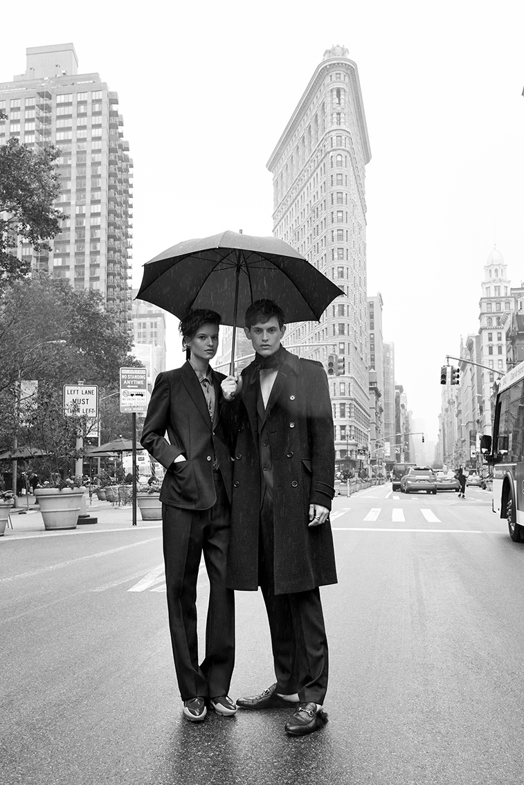 The models pose under an umbrella in this black and white image