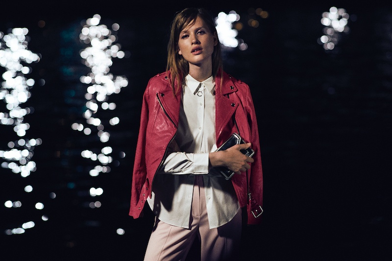 The model sports a Mackage motor jacket in pink