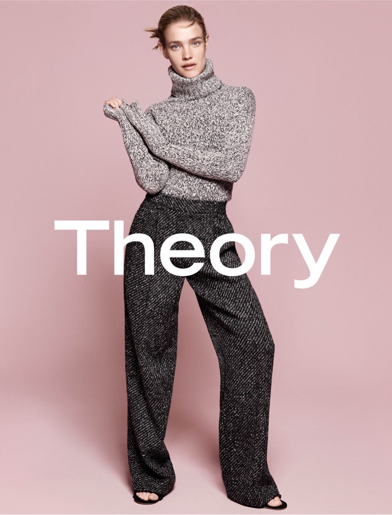 Natalia wears a turtle neck sweater and high-waist pants