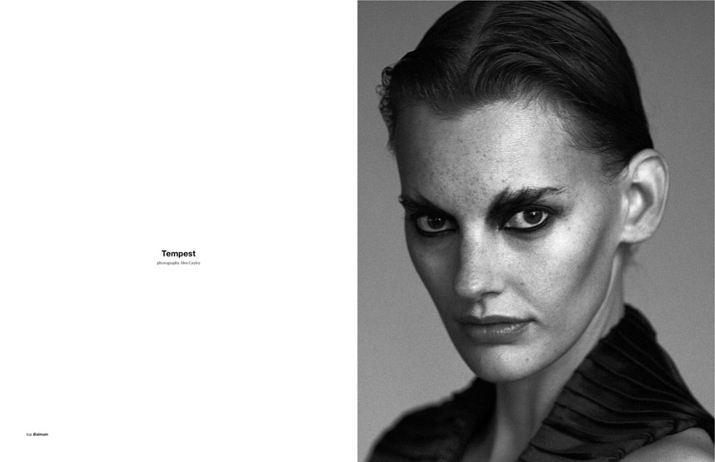 The model poses in dark fashions for the magazine