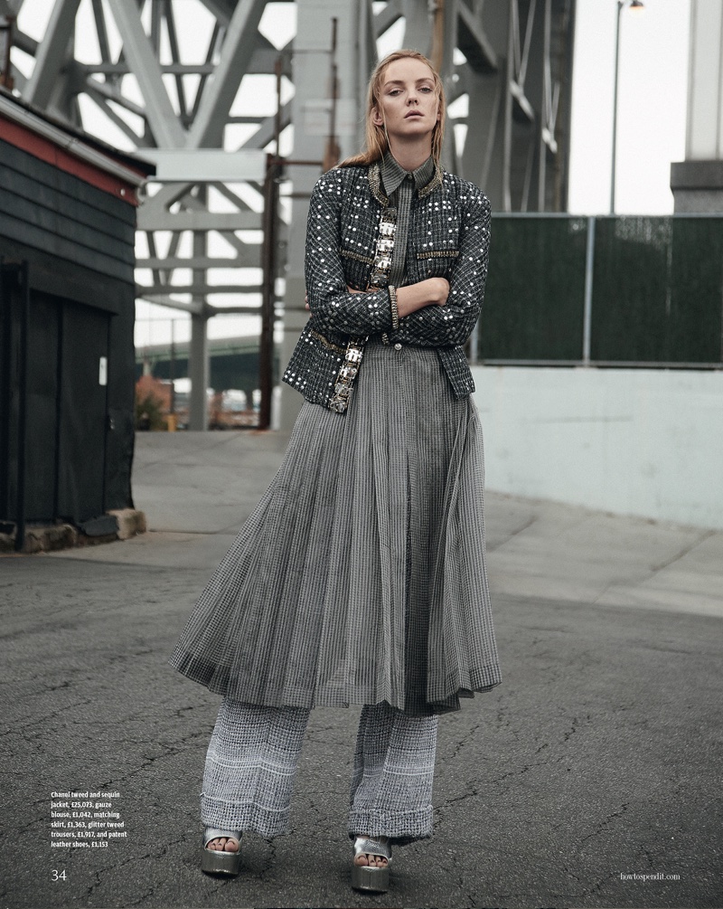 SHADES OF GREY: The model poses in a tweed and sequin embellished jacket from Chanel with trousers, skirt and leather heels also from the brand