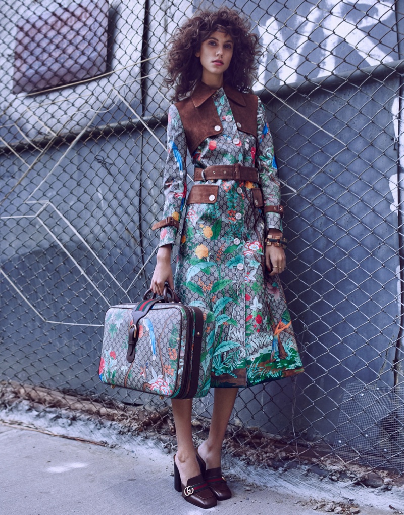 Antonina Petkovic poses outdoors in a Gucci coat with matching luggage