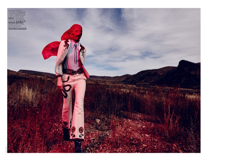 Marique models embroidered Gucci jacket, shirt and pants in an outdoor setting