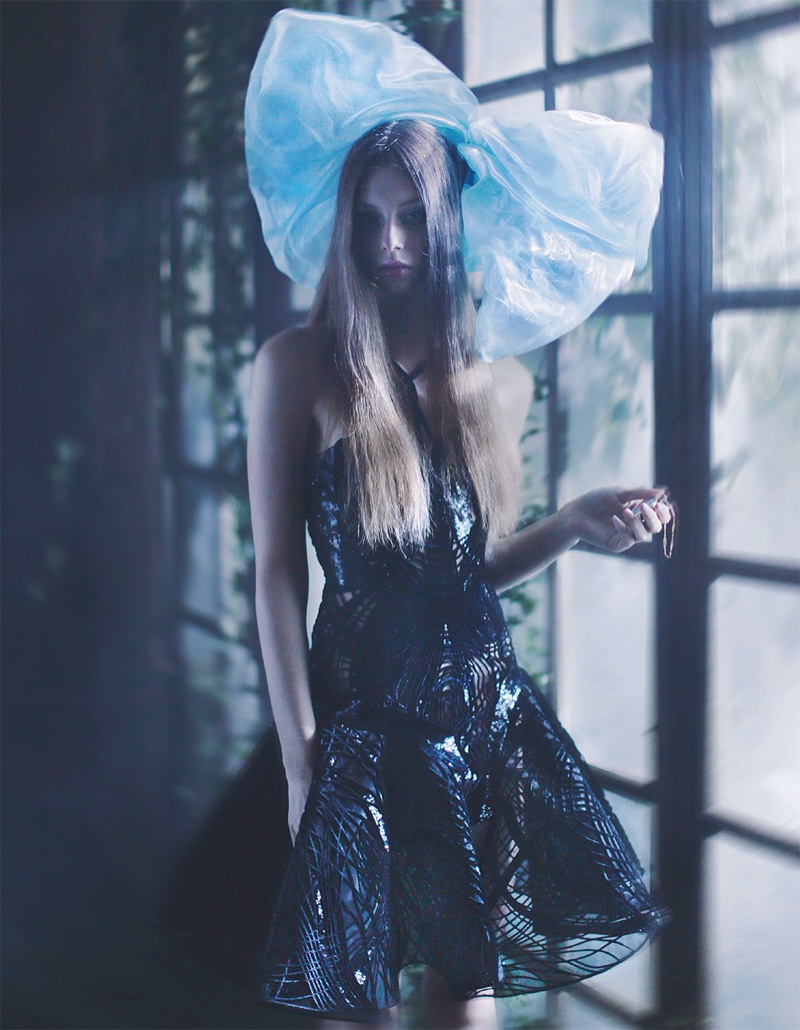 Lauren de Graaf gets mysterious in an Atelier Versace embellished dress and blue oversized bow by Simon Azoulay 