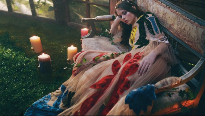 Lounging in a multi-colored Valentino gown, Lauren de Graaf stuns