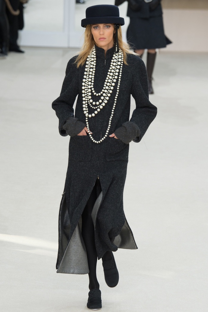 Anja Rubik walks the runway at Chanel's fall-winter 2016 show during Paris Fashion Week