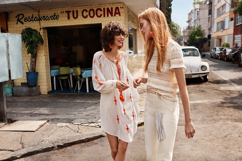Mica Arganaraz models a long sleeve dress and Rianne models a white t-shirt and jeans from H&M's spring 2016 collection