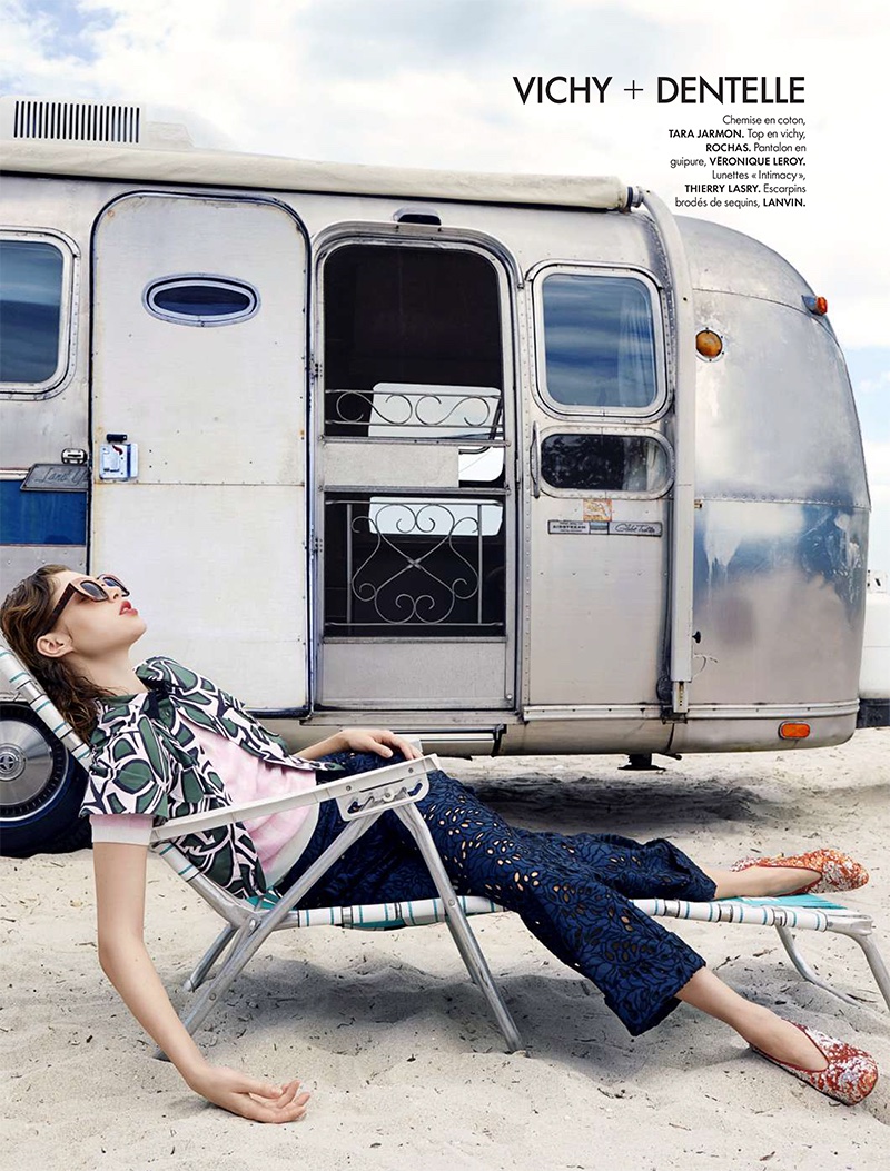 Lounging in a beach chair, Anais poses in printed top, pink shirt and lace pants