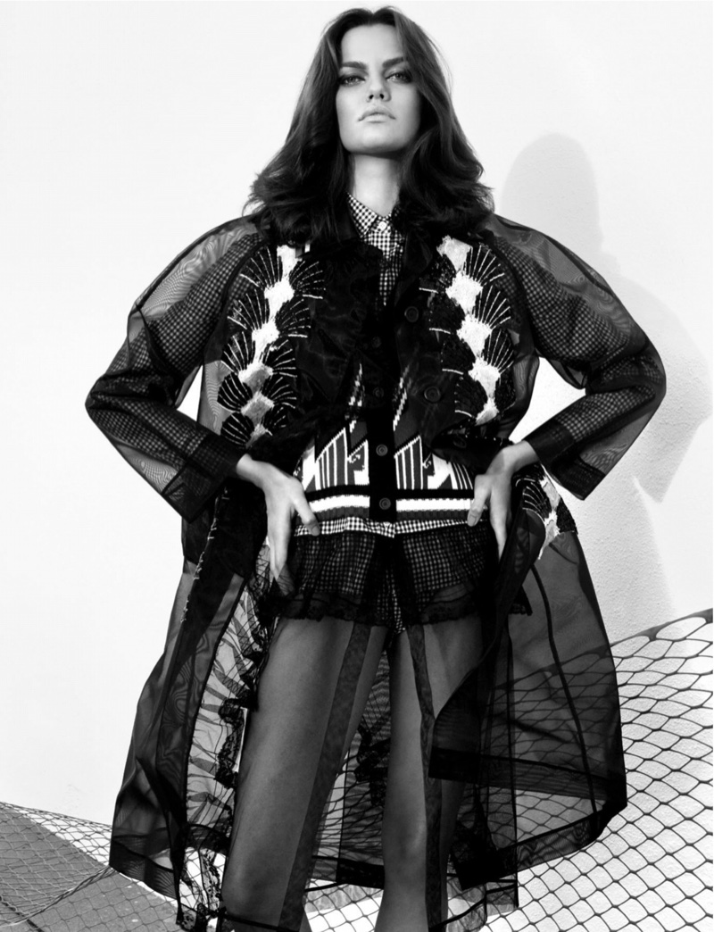 Photographed in black and white, Barbara models a layered ensemble by Miu Miu