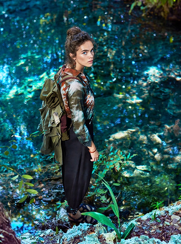 Captured outdoors, Jena Goldsack wears Valentino jacket with camouflage looking print