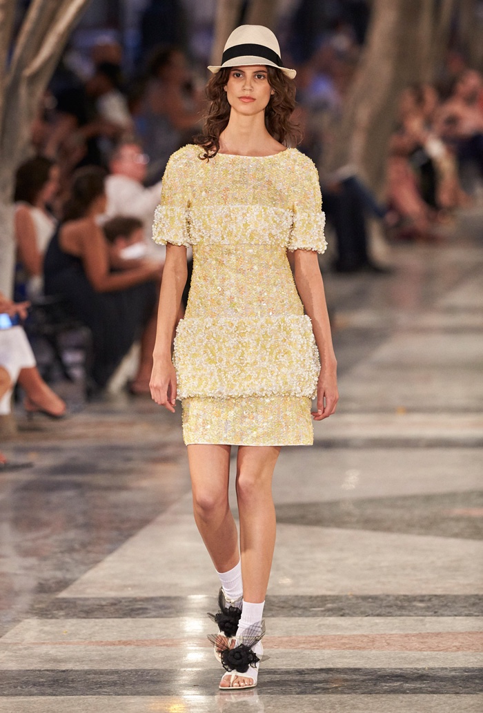 Antonina Petkovic walks Chanel’s cruise 2017 show wearing an embellished dress with a panama hat