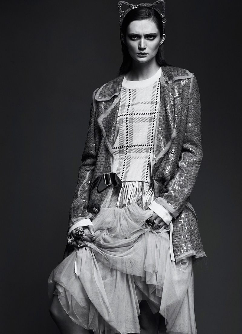 Captured in black and white, Sophie Touchet wears Lanvin dress (as jacket), Chloe sweater, Needle & Thread skirt and cat ear headband by Eugenia Kim