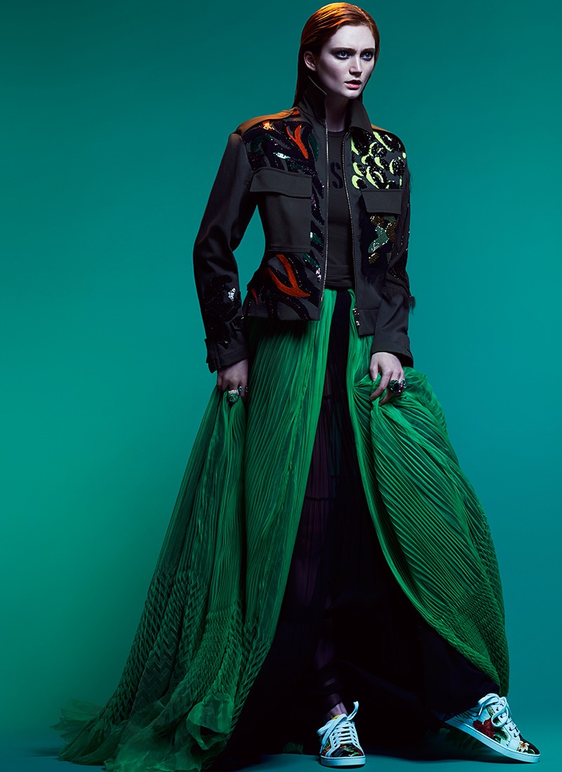 The model looks sporty glam in Versace jacket and top with green skirt from DSquared2 and Christian Louboutin sneakers
