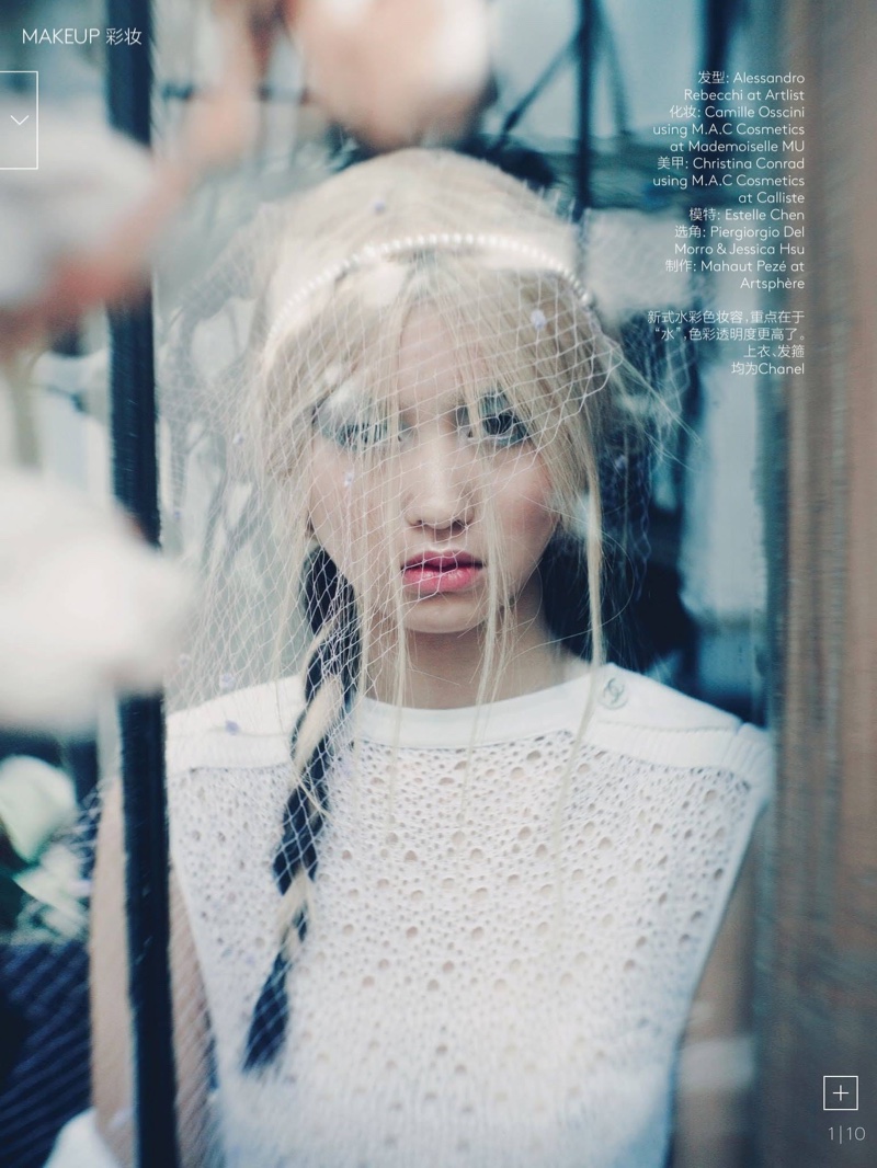 The model wears a long braid in the feature