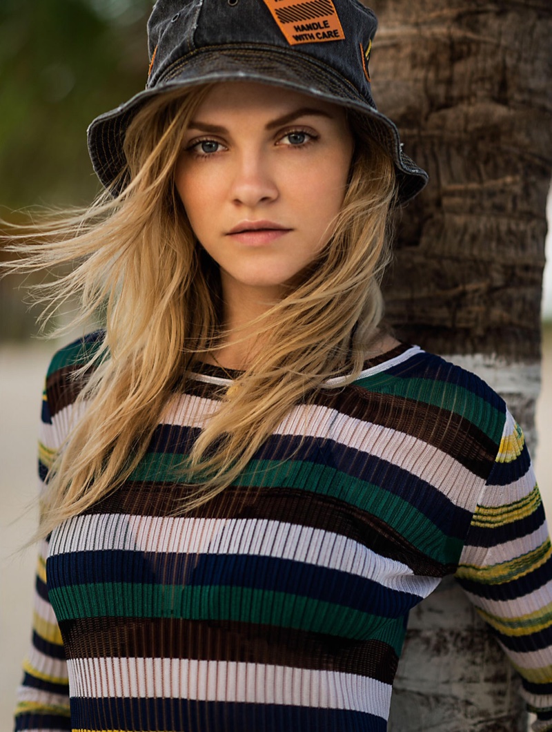 The model poses in vacation-ready looks for the fashion editorial