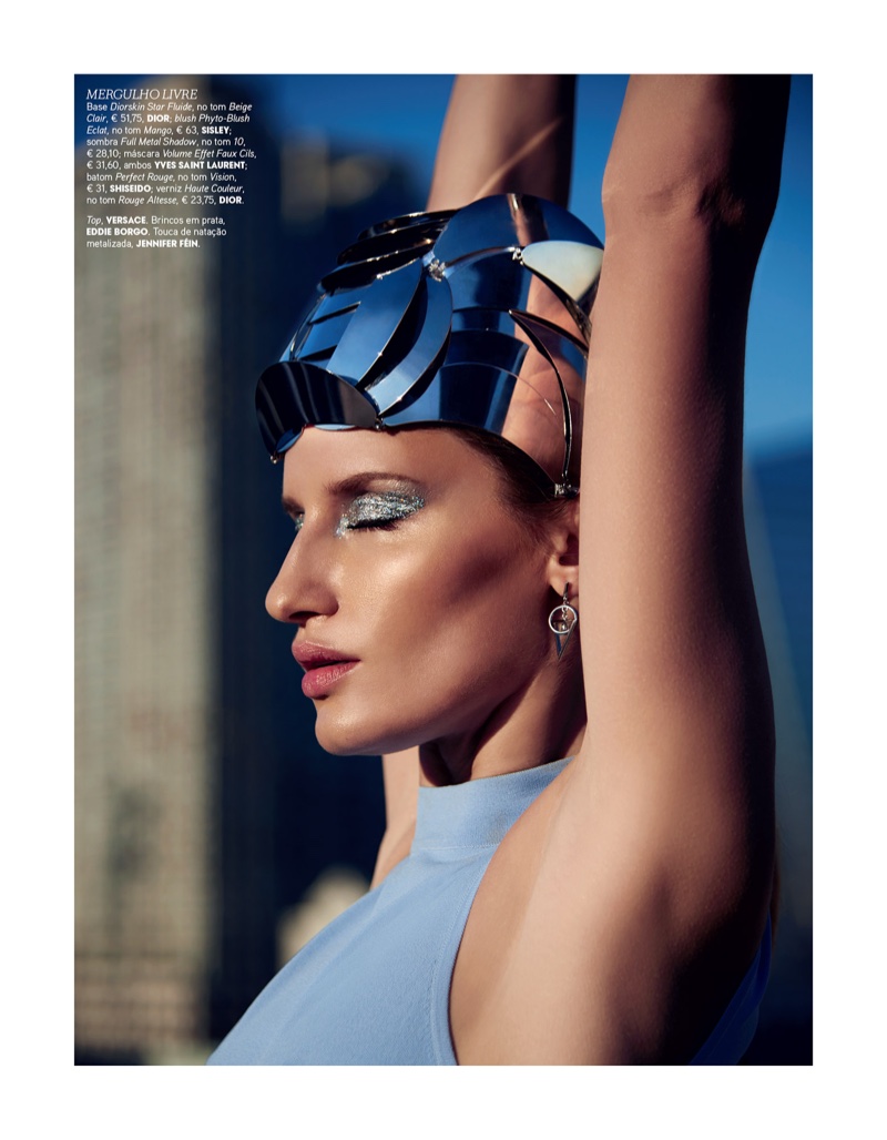 Linda Vojtova looks ready to dive into summer with a metallic eyeshadow makeup look