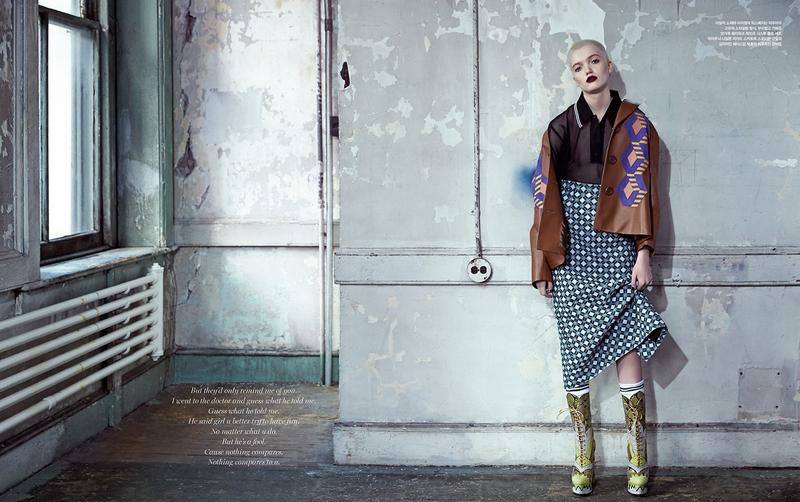 Posing in gritty setting, Ruth Bell models Miu Miu jacket, top, skirt and boots