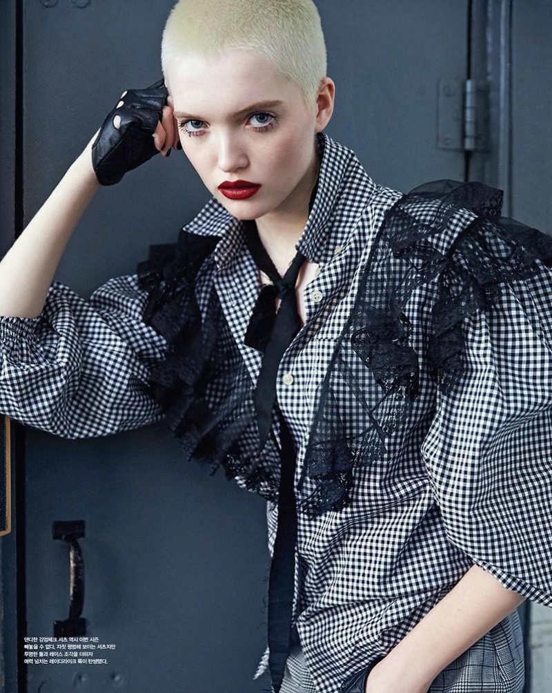 Ruth Bell shows off her buzzed haircut while modeling Miu Miu dress