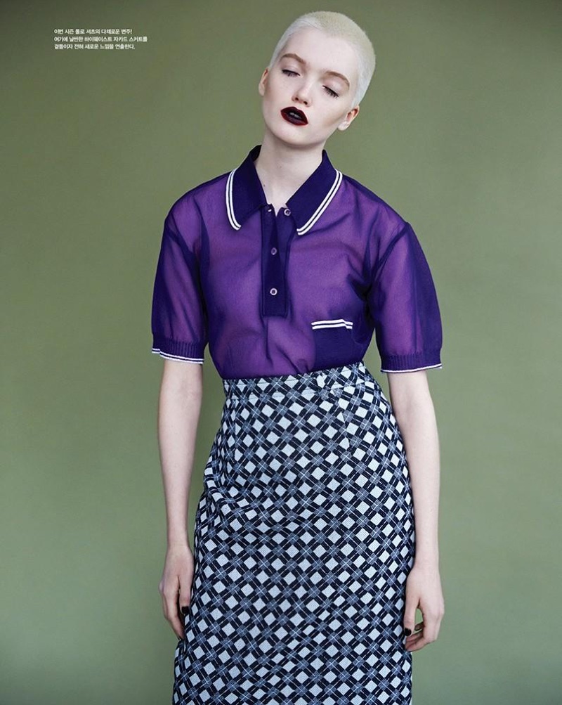Model wears purple Miu Miu collared top with diamond print skirt
